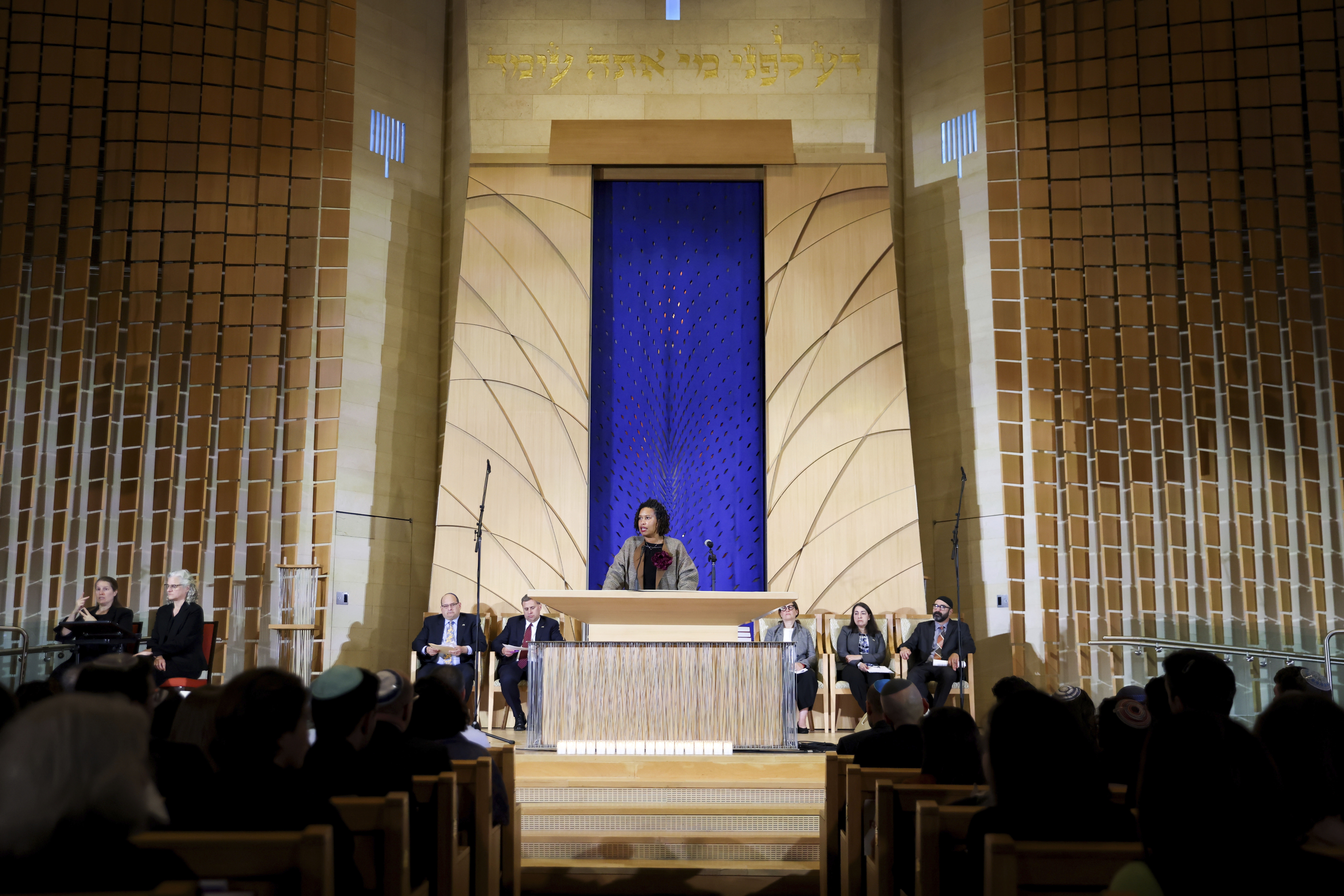 <p>Every seat was filled in the sanctuary, with some attendees sitting on the floor to hear leaders speak.</p>
<p>Small blue and white Israeli flags hung from the crowded balcony and a blue and white projection covered the front of the synagogue.</p>
<p>&#8220;We recognize that the acts of terrorism are unfolding nearly 6,000 miles away. But we know the pain and impact is right here in this room and in our city. I want to extend my sympathy and solidarity to everyone who was hurting and living in fear these past four days,&#8221; Bowser said.</p>
