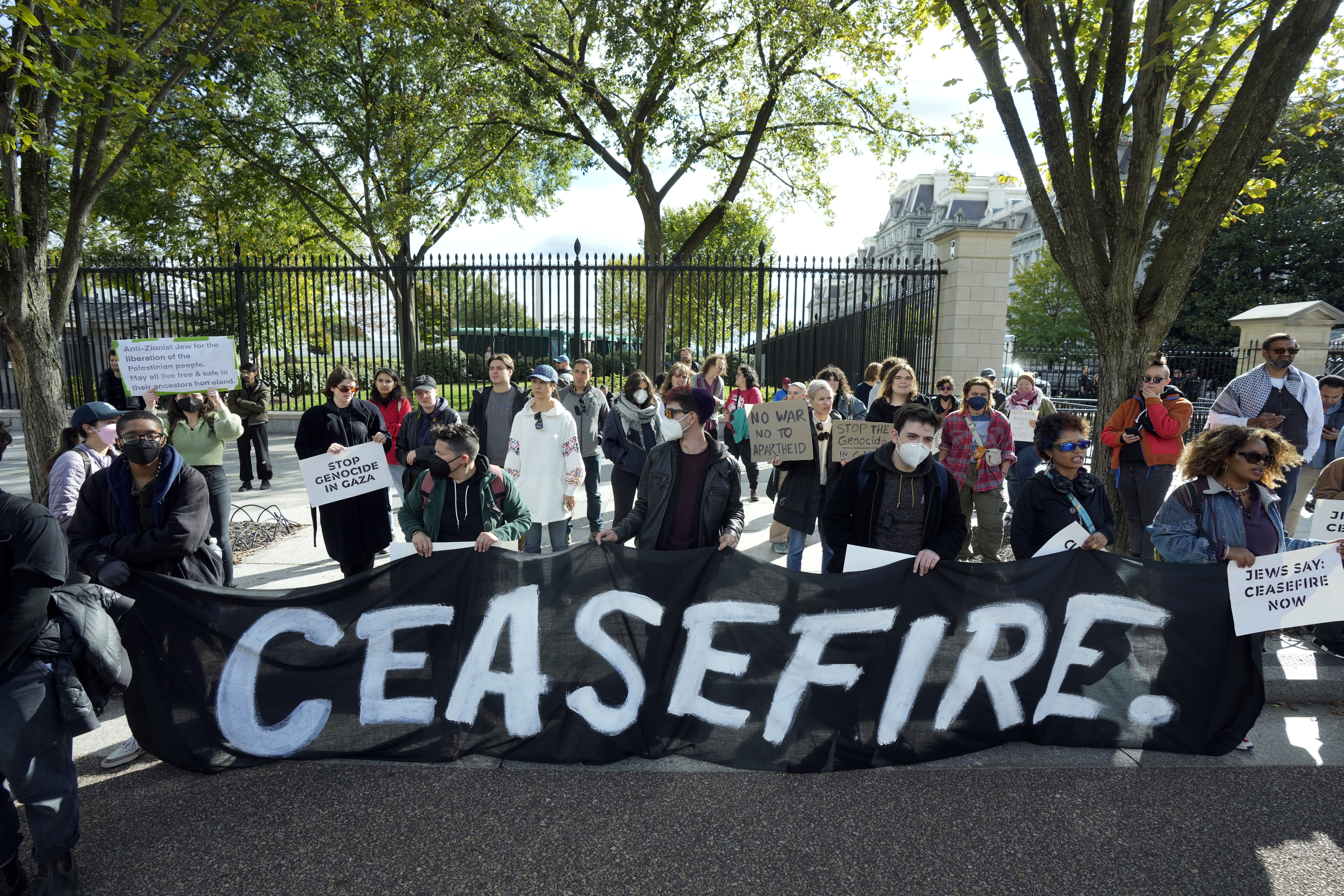 Protesters calling for a ceasefire in Gaza protest outside the White House in Washington, Monday, Oct. 16, 2023. (AP Photo/Manuel Balce Ceneta)