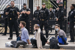 Members of the Secret Service detain protesters after they blocked an entrance to the White House during a demonstration advocating for a ceasefire in Gaza near the White House in Washington, Monday, Oct. 16, 2023. (AP Photo/Nathan Howard)