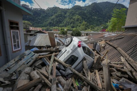 Indian rescuers are flying into the region where a flood washed out bridges and killed at least 74