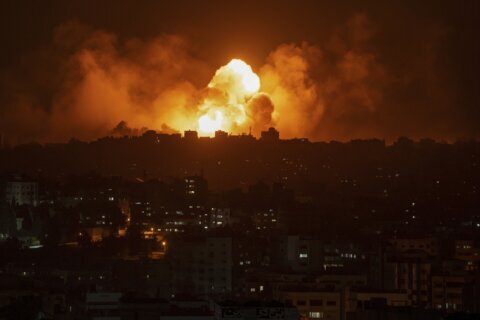 Israel strikes and seals off Gaza after incursion by Hamas, which vows to execute hostages