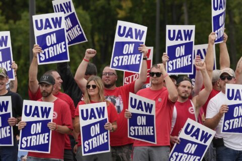 More Americans support striking auto workers than car companies, an AP-NORC poll shows