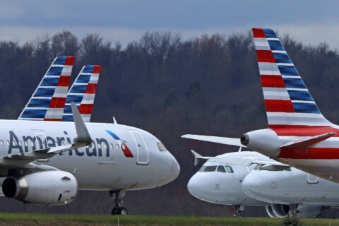 American Airlines lost $545 million in the third quarter on higher labor costs while rivals prosper