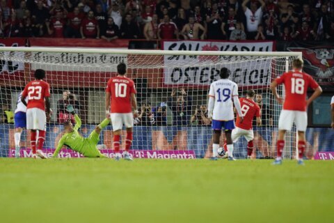 Sabitzer's penalty sends Austria to European Championship in day overshadowed by Brussels shooting