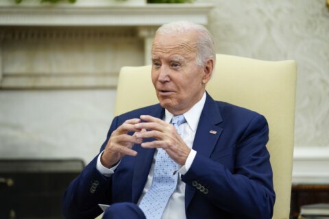 Biden says he had to use Trump-era funds for the border wall. Asked if barriers work, he says 'No'