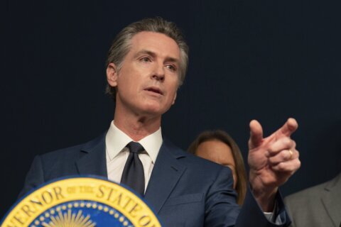 California governor signs 2 major proposals for mental health reform to go before voters in 2024