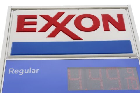 Exxon profit falls compared with record-setting numbers last year, but consolidation in full swing