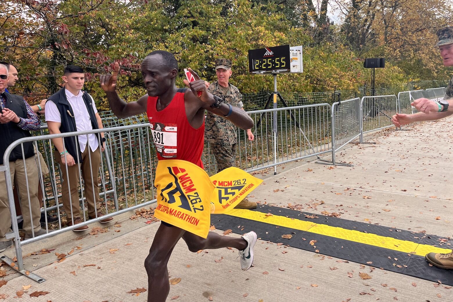 Julius Kogo from Kenya crosses the Marine Corps Marathon finish line first on Sunday.