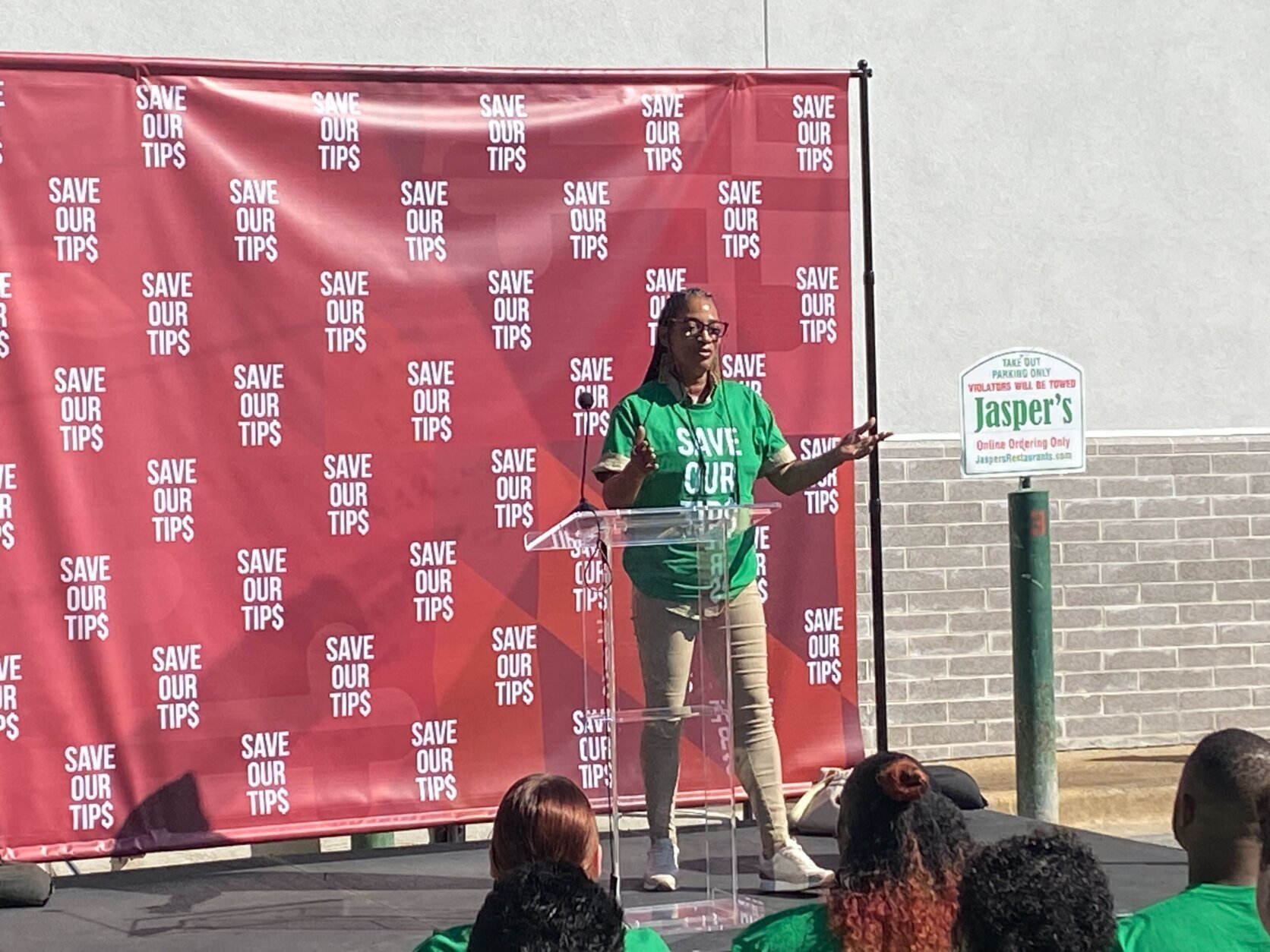 Those against a minimum wage increase for tipped workers in Prince George's County hold a rally on Thursday, wearing green in solidarity.