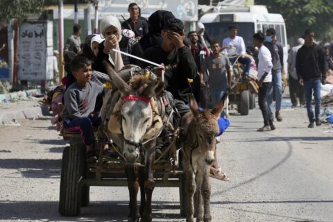 Weary families trudge through Gaza streets, trying to flee the north before Israel's invasion