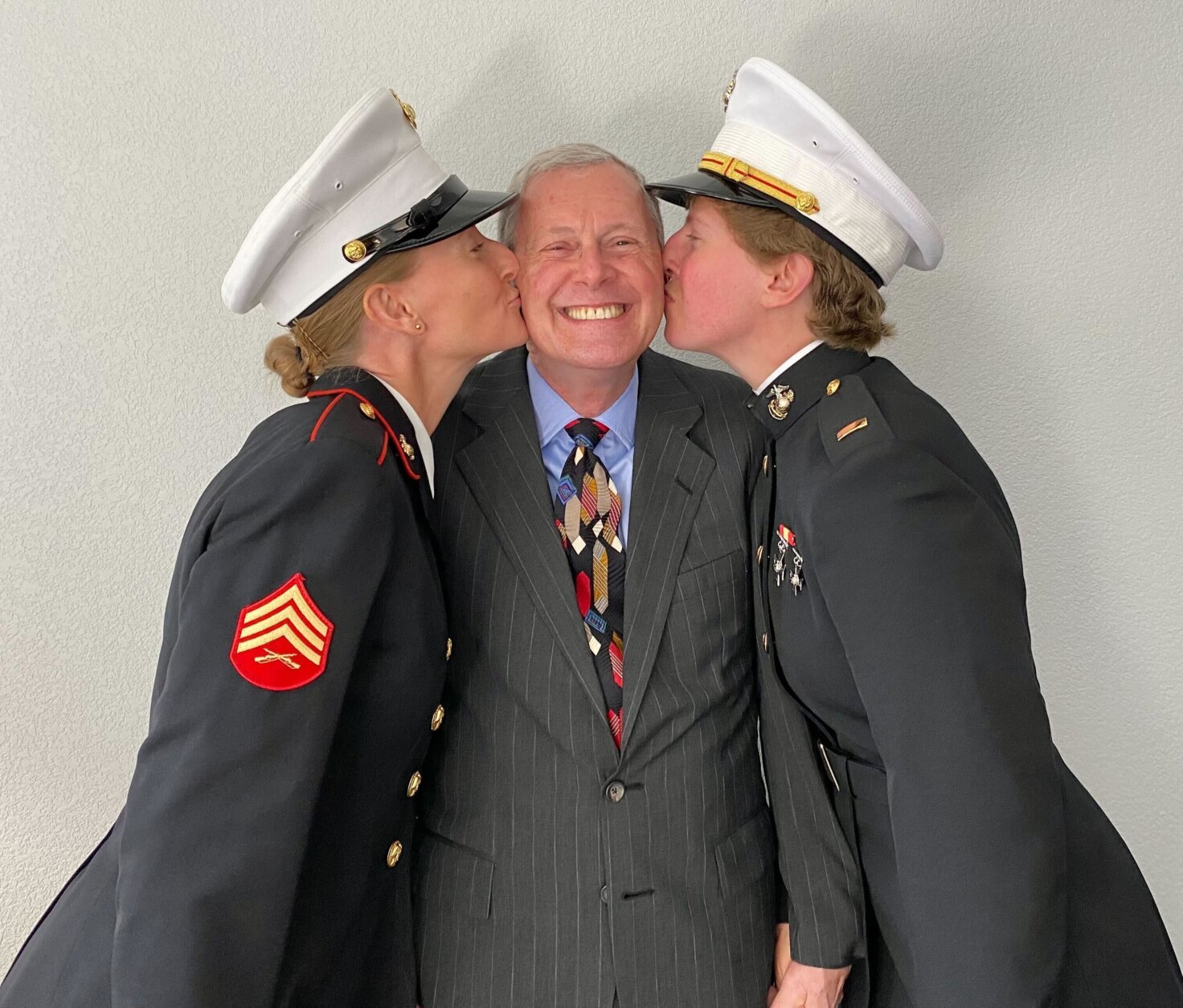 Two Marine daughters and their father