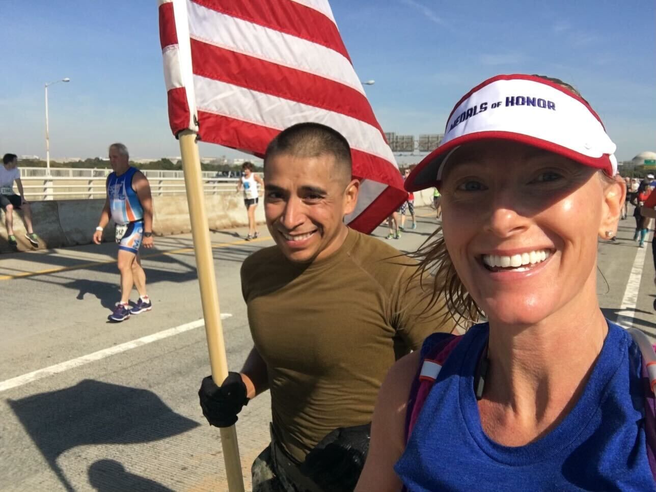 Marine carry a flag and runner