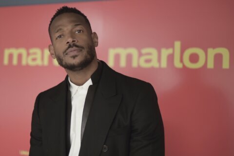 Marlon Wayans says he is being unfairly prosecuted after being racially targeted by gate agent