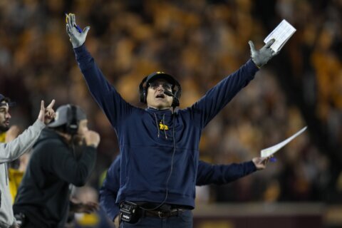 No. 2 Michigan romps past Minnesota 52-10 with pair of pick-6s for 17th straight win in Big Ten