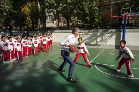 California's Newsom plays hardball in China, collides with student during schoolyard basketball game