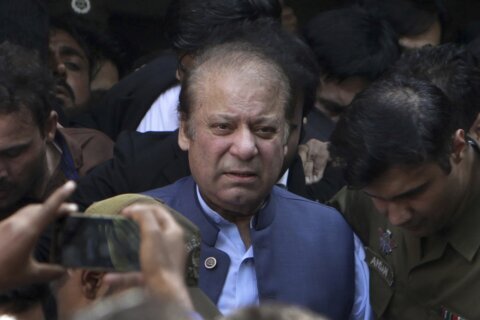 Pakistan's self-exiled former Prime Minister Nawaz Sharif returns home ahead of a parliamentary vote