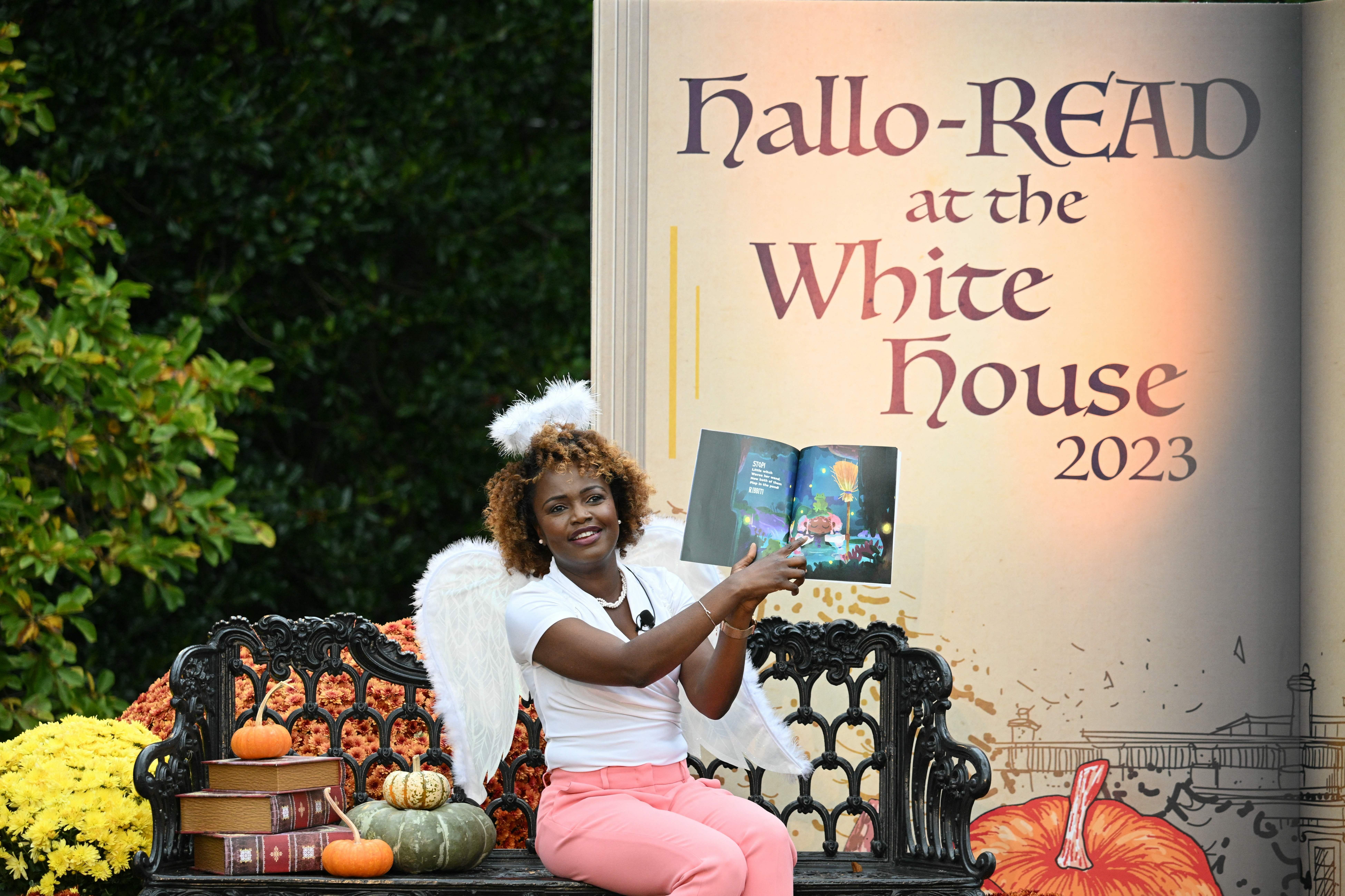 White House Press Secretary Karine Jean-Pierre is dressed like an angel while she reads to kids
