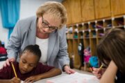 Maryland State Superintendent Carey Wright with students in a classroom.