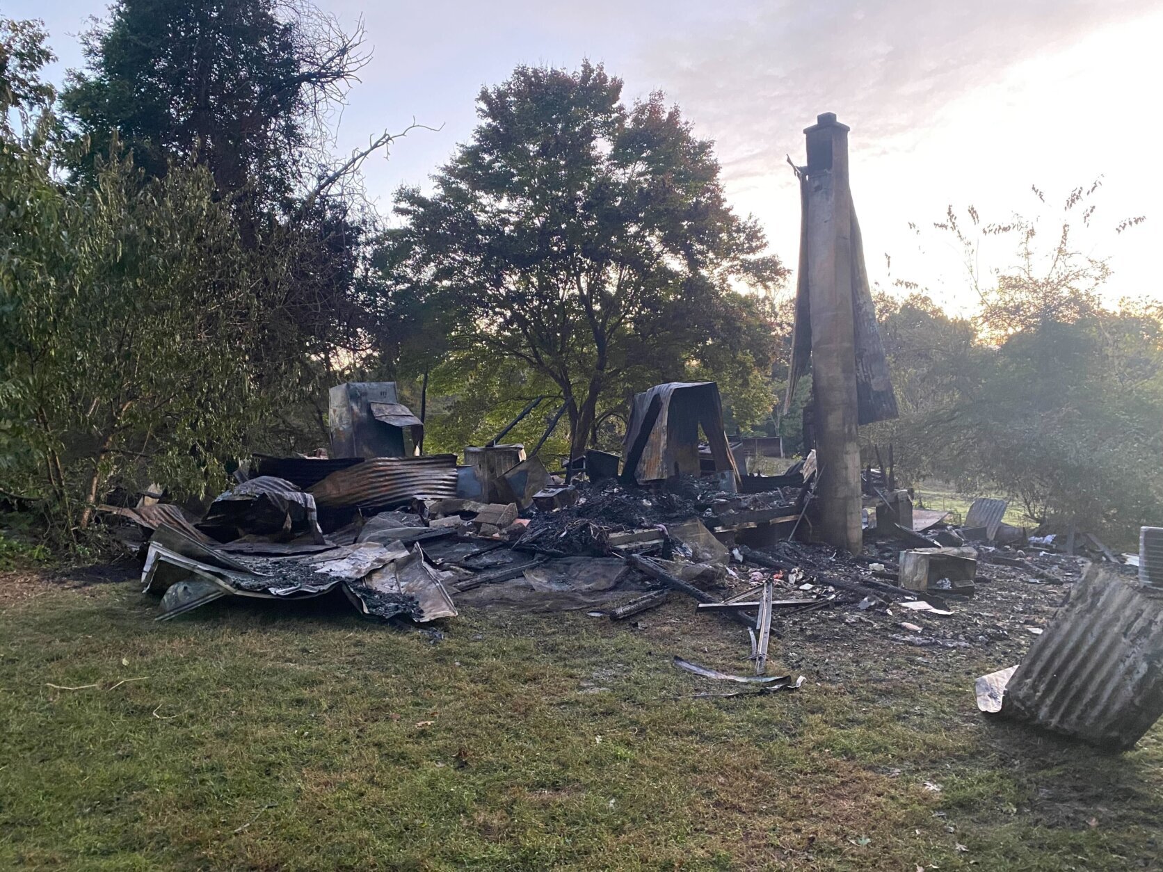 Ash, rubble and chimney following deadly house fire.