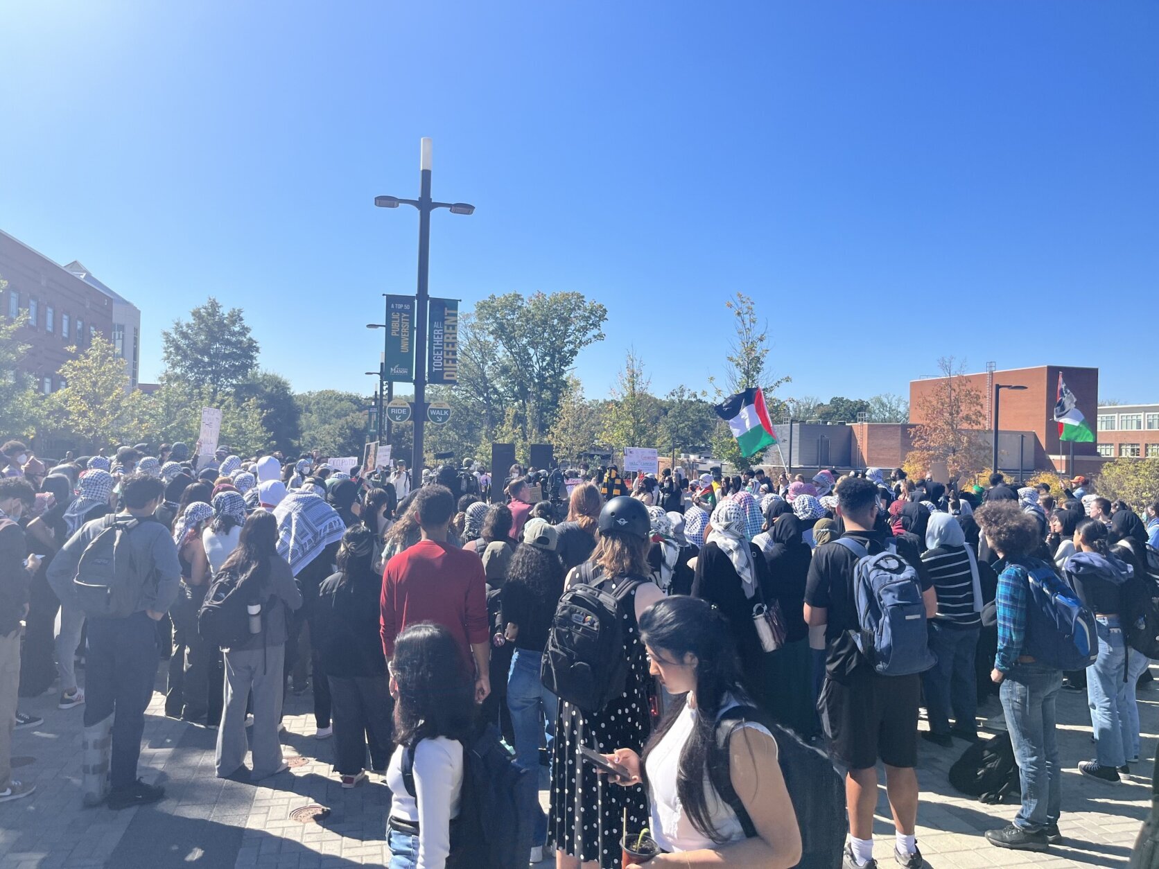 A crowd of students with a cross rally.