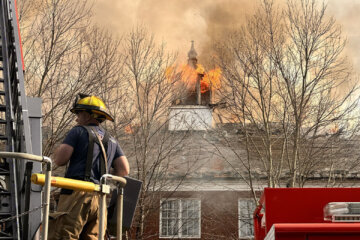 Firefighters battle a blaze at the Church of Jesus Christ of Latter-Day Saints on Western Avenue in Chevy Chase on Nov. 20, 2023. (WTOP/Jimmy Alexander)
