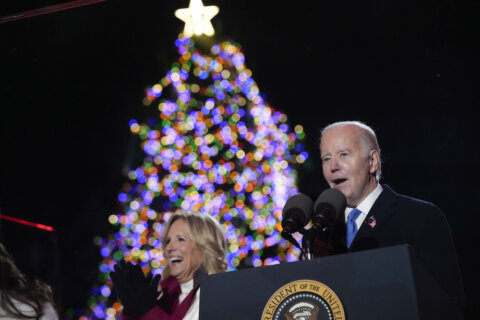 Biden lights the National Christmas Tree, taking his turn to bring holiday spirit to Washington