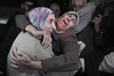Hamas releases a third group of hostages as part of truce, and says it will seek to extend the deal