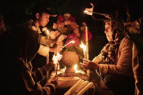 With flowers, altars and candles, Mexicans are honoring deceased relatives on the Day of the Dead
