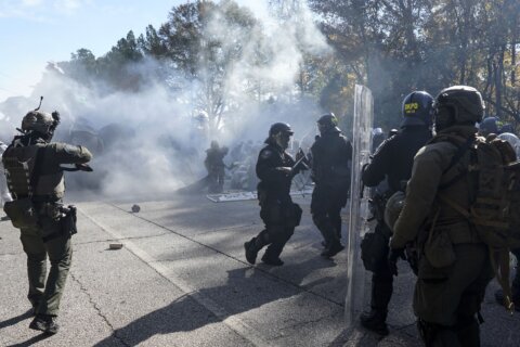 Police and protesters clash at Atlanta training center site derided by opponents as 'Cop City'