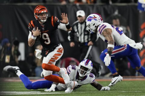 Burrow passes for 348 yards and 2 TDs and Bengals' defense clamps down on Bills in 24-18 win