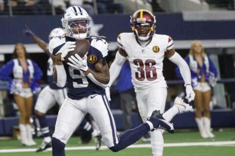Bland, Prescott help Cowboys to 13th straight home win with 45-10 victory over Commanders
