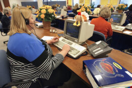 DOWNERS GROVE, IL - NOVEMBER 24: 21-year-veteran Butterball Turkey Talk-Line home economist Jan Allen, left, answers questions on her telephone headset at the Butterball Turkey Talk-Line headquarters November 24, 2003 in Downers Grove, Illinois. The Butterball Talk-Line was created to assist everyone from first-time cooks to seasoned chefs with preparing their holiday bird. Originally staffed with six home economists who responded to 11,000 phone calls in its first year alone, today the Talk-Line is staffed with nearly 50 home economists and nutritionists who respond to more than 100,000 questions each November and December. ConAgra Foods opened the Butterball Turkey Talk-Line in 1981. (Photo by Tim Boyle/Getty Images)