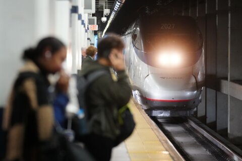 Amtrak ridership hits a record high, trims losses