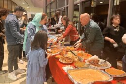 Volunteers pass out food at Thanksgiving event