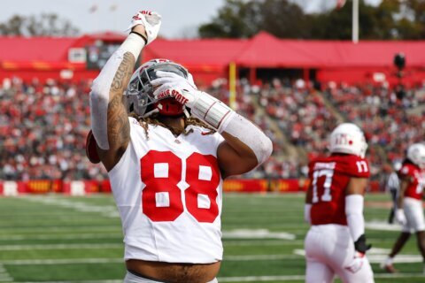 Sparked by Hancock's 93-yard pick 6, No. 3 Ohio State rallies from halftime deficit to beat Rutgers