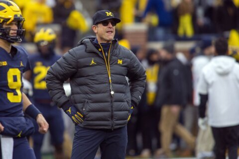 Michigan’s Jim Harbaugh says he would take less salary if it meant college athletes would be paid