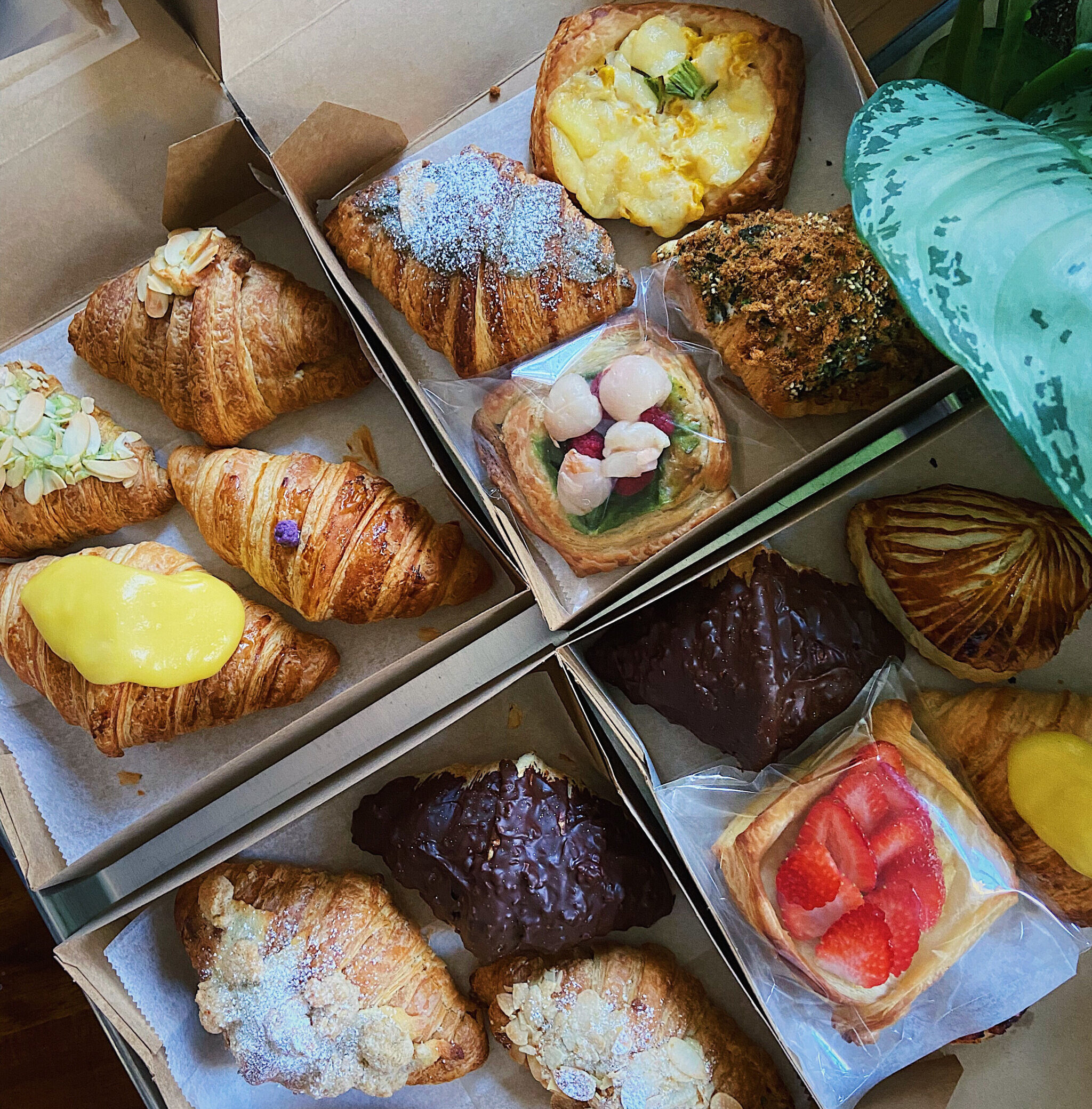 Boxes filled with croissants and other pastries.