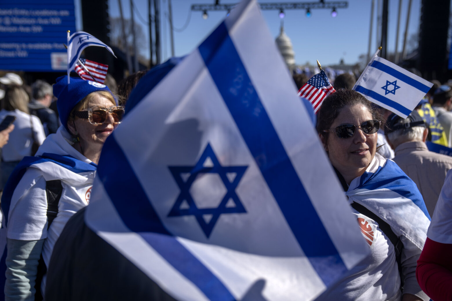 Participants wearing miniature Israeli flags stand on the National Mall at the March for Israel on Tuesday, Nov. 14, 2023, in Washington. (AP Photo/Mark Schiefelbein)
