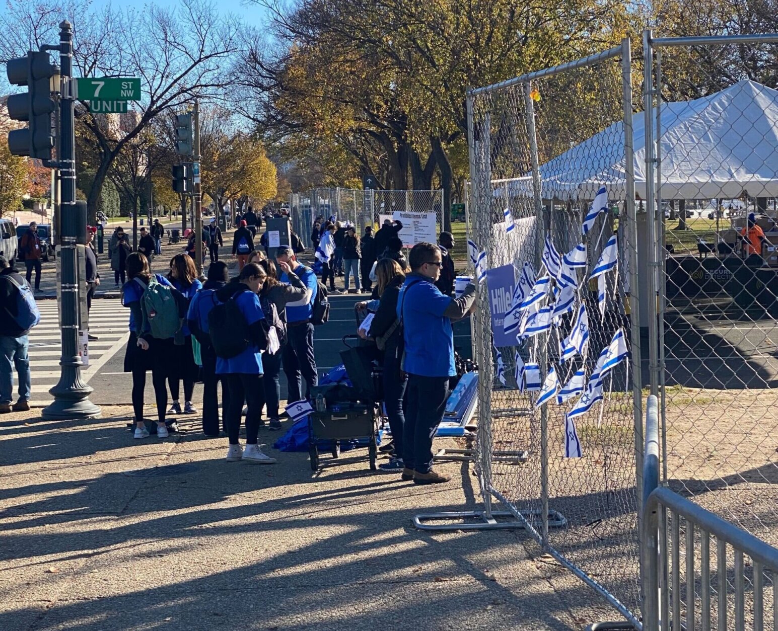 Gates outside the march are decorated with Israeli flags.