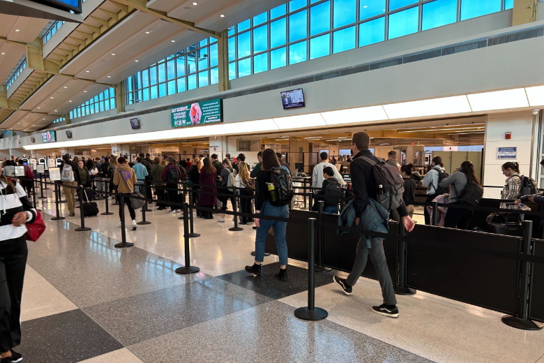 Travelers go through DCA security checkpoints