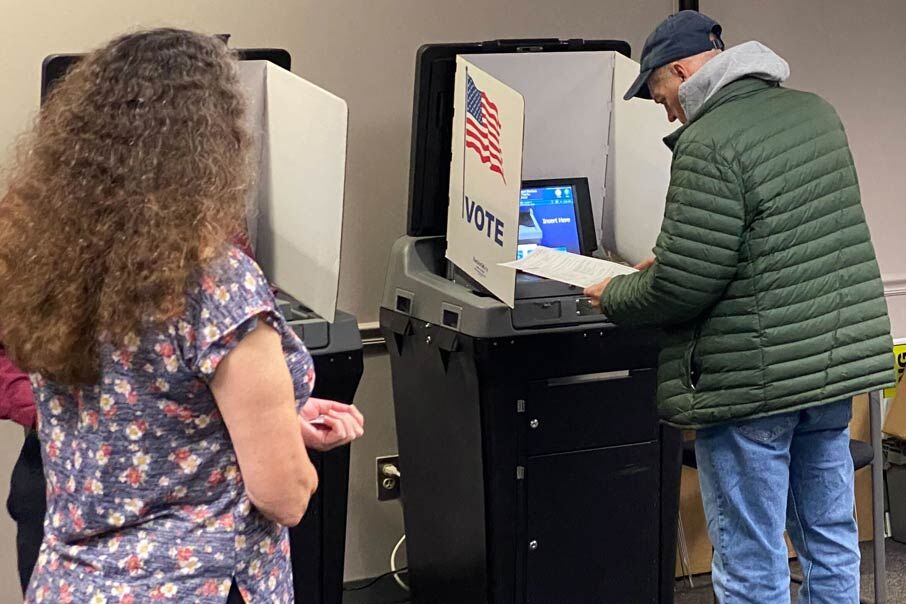 This man is casting his ballot inside the Fairfax County Government Center
