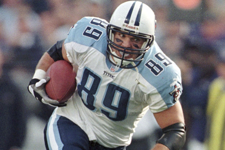 FILE - Tennessee Titans tight end Frank Wycheck runs with the ball during a football game against the Baltimore Ravens, Dec. 5, 1999, in Baltimore. The three-time Pro Bowler Wycheck, who threw the lateral that started the “Music City Miracle” launching the Tennessee Titans' run to the franchise's lone Super Bowl appearance, has died at age 52. Wycheck died at his Chattanooga, Tenn., home after an apparent fall where he hit his head Saturday morning, Dec. 9, 2023, according to a statement from his family released through the Legacy consulting firm. (AP Photo/Roberto Borea, File)