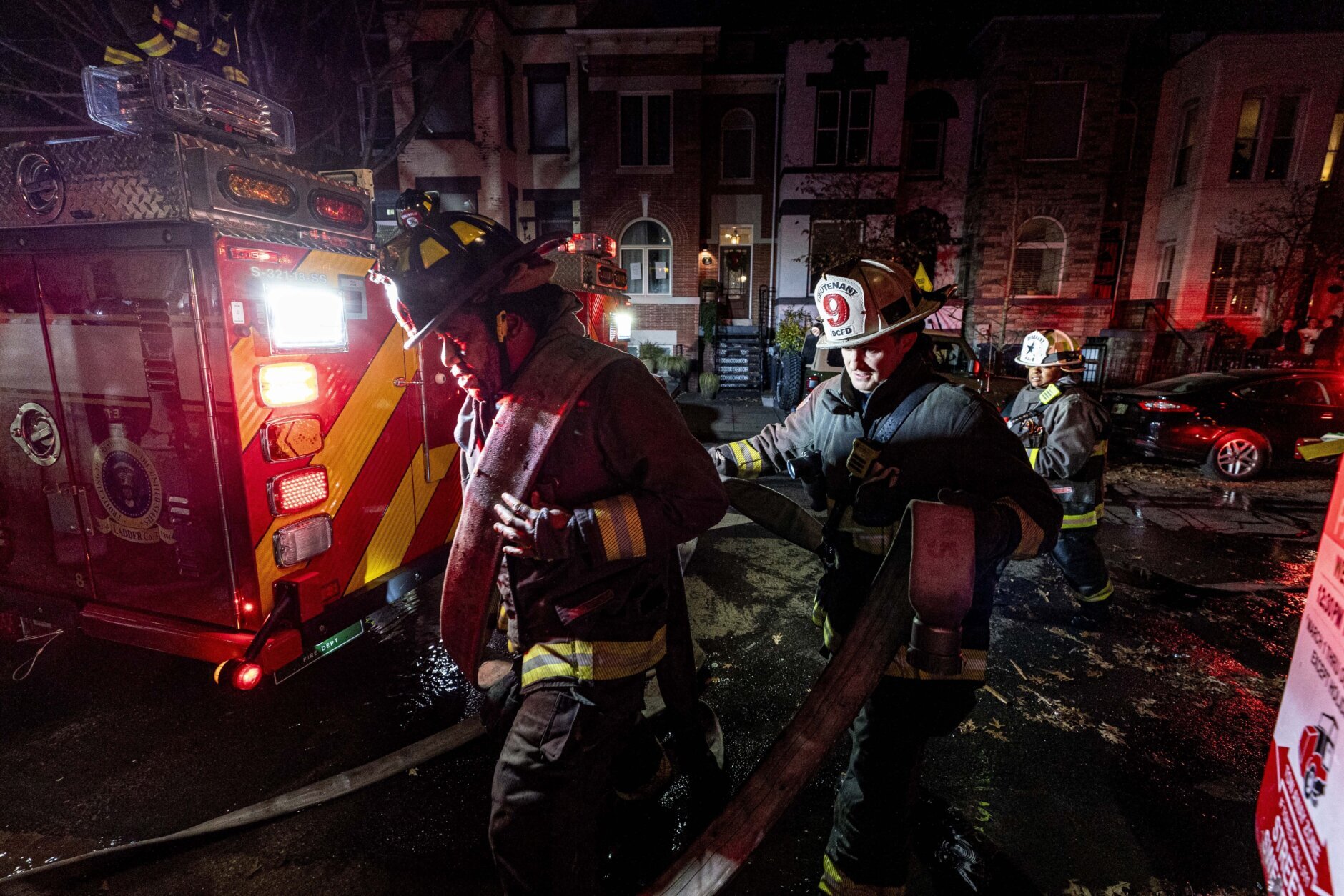 Firefighters battle a two alarm fire that started in a former fire station, Old Engine Company No. 12, now a landmark along North Capitol Street, in the Bloomingdale neighborhood of Washington, Friday, Dec. 15, 2023. (AP Photo/Andrew Harnik)