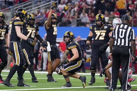 Schrader runs for 128 yards and a TD as No. 9 Missouri beats No. 7 Ohio State 14-3 in Cotton Bowl