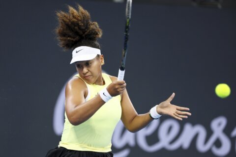 Naomi Osaka returns to elite tennis from a maternity break and wins her first match in Brisbane