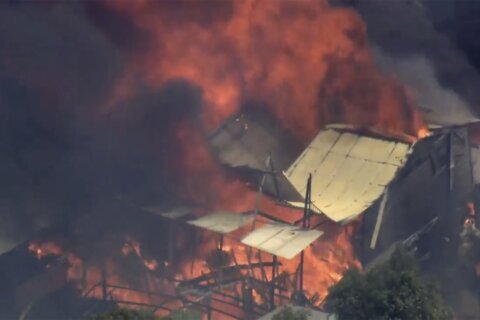 A wildfire in Australia on the outskirts of Perth destroys at least 2 homes and injures 2 people