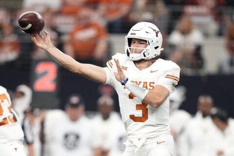 Ewers throws 4 TDs as No. 7 Texas bids farewell to Big 12 with 49-21 title win over Oklahoma State