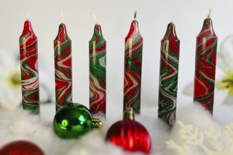 For a holiday craft that creates light, try making marbled candles by hand