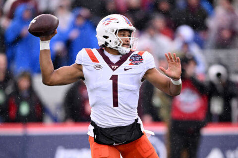 Drones handles the rain, leads Virginia Tech to 41-20 win over No. 23 Tulane in the Military Bowl
