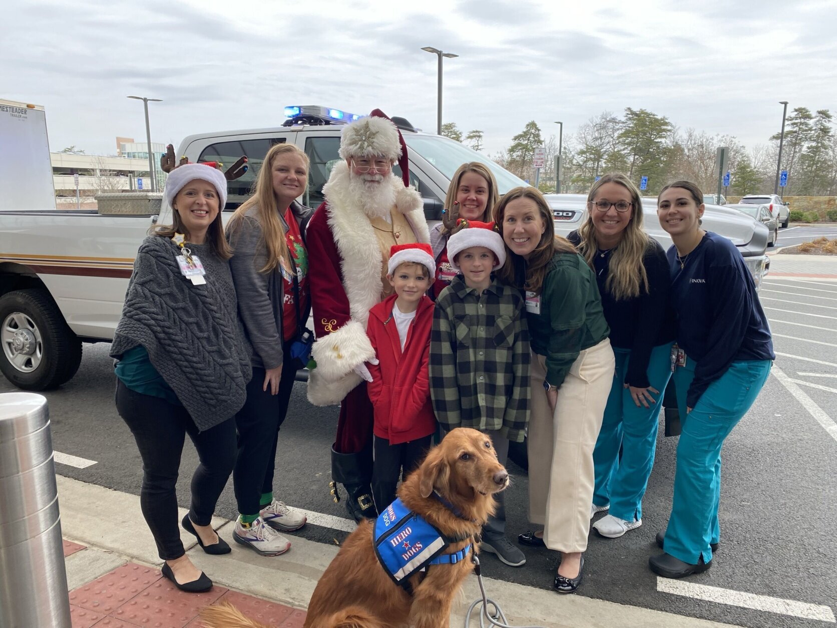 Santa with hospital staff and patient's family